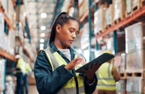 Image-Woman looking at inventory in tablet