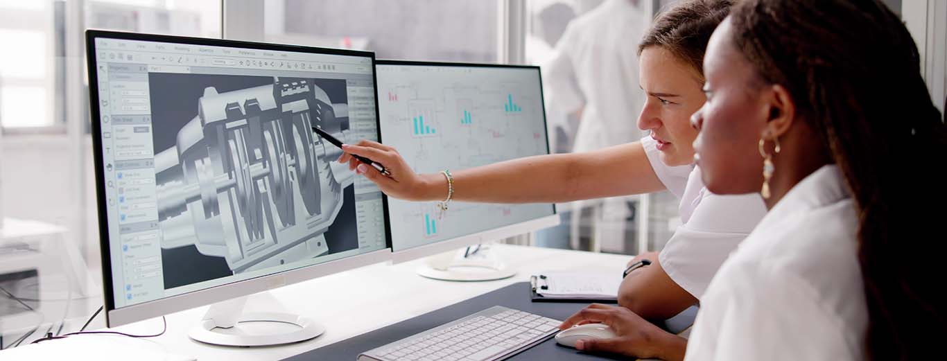 Image-Engineers reviewing CAD model and parts lists on two computer screens