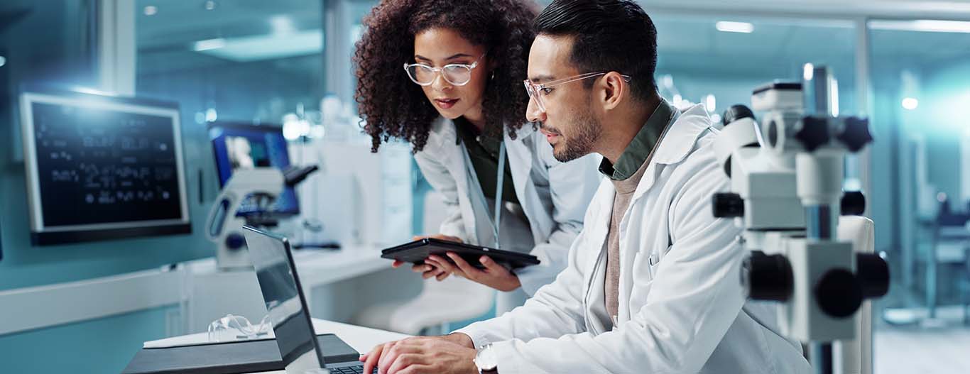 Image-Medical engineers with tablet in lab or R&D setting  reviewing research technology