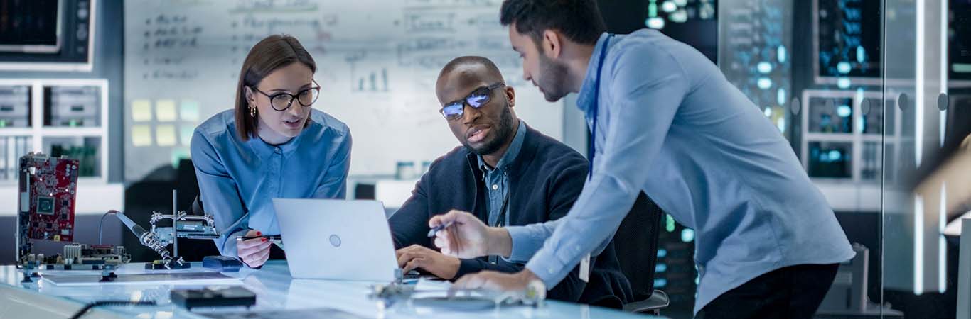 Image- Engineers collaborating,  analyzing data using laptop computer in a R&D setting