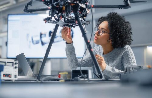 Female Engineer Working On Drone