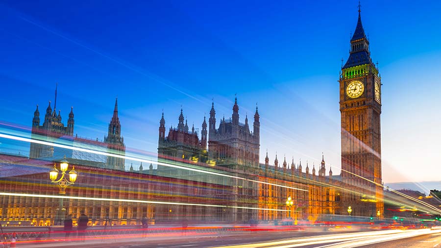Image-London evening skyline with Big Ben and traffic streaking by