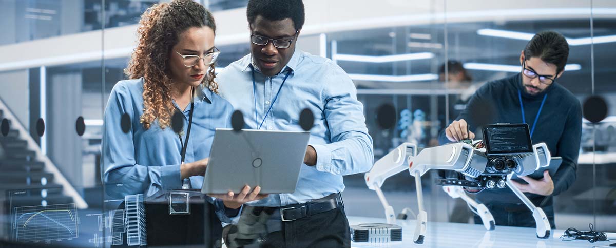 Image-Engineers Use Laptop to Connect and Analyze Robotics