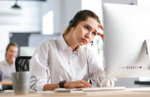 Image-Frustrated female customer support worker