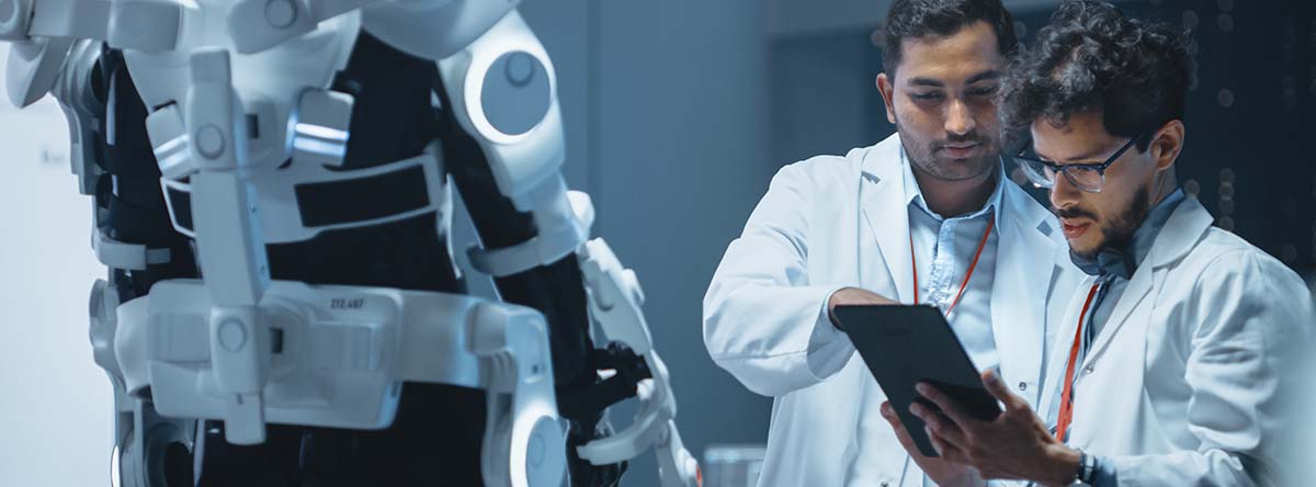 Image-Team of Engineers and Scientists Work on Robotics Exoskeleton Prototype.