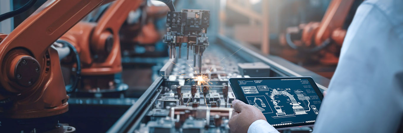Image-Robotic Arm assembling electronics in factory setting 