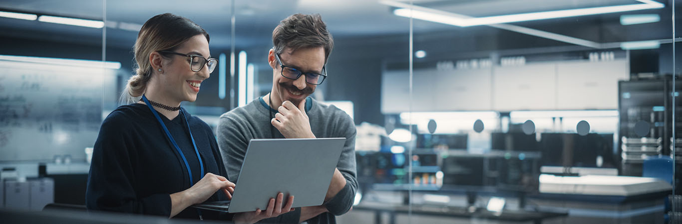 Image-Engineers discuss content on a laptop