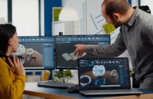 Image-Man and woman collaborating over CAD design