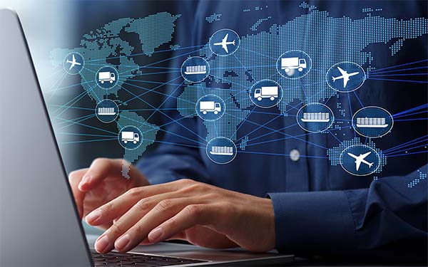 Image-Professional using laptop to track freight, global supply chain and logistics management. 
