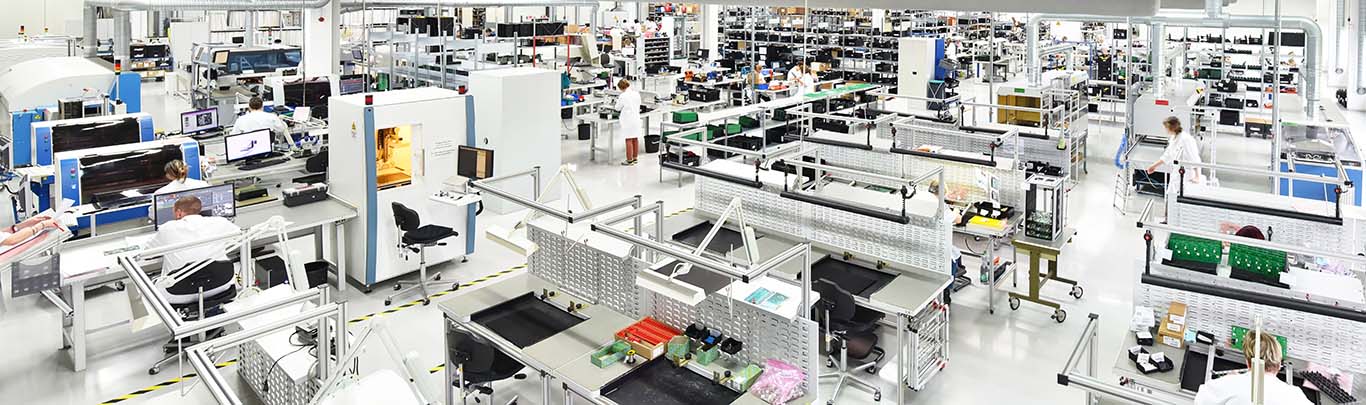 Why Integration Matters More Than Ever Image-modern Machinery, interior and equipment in factory setting, producing electronic components