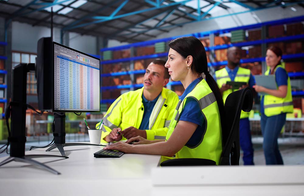Engineers looking at spreadsheets