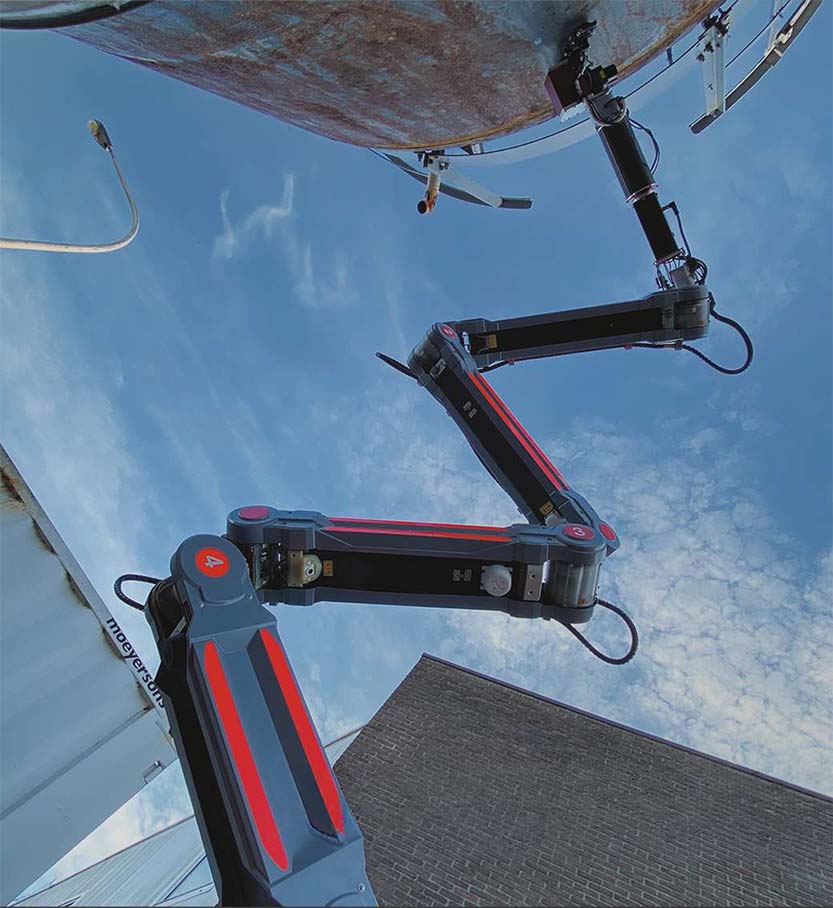 Image-hibot's float arm reaching up 6 meters, performing a task
